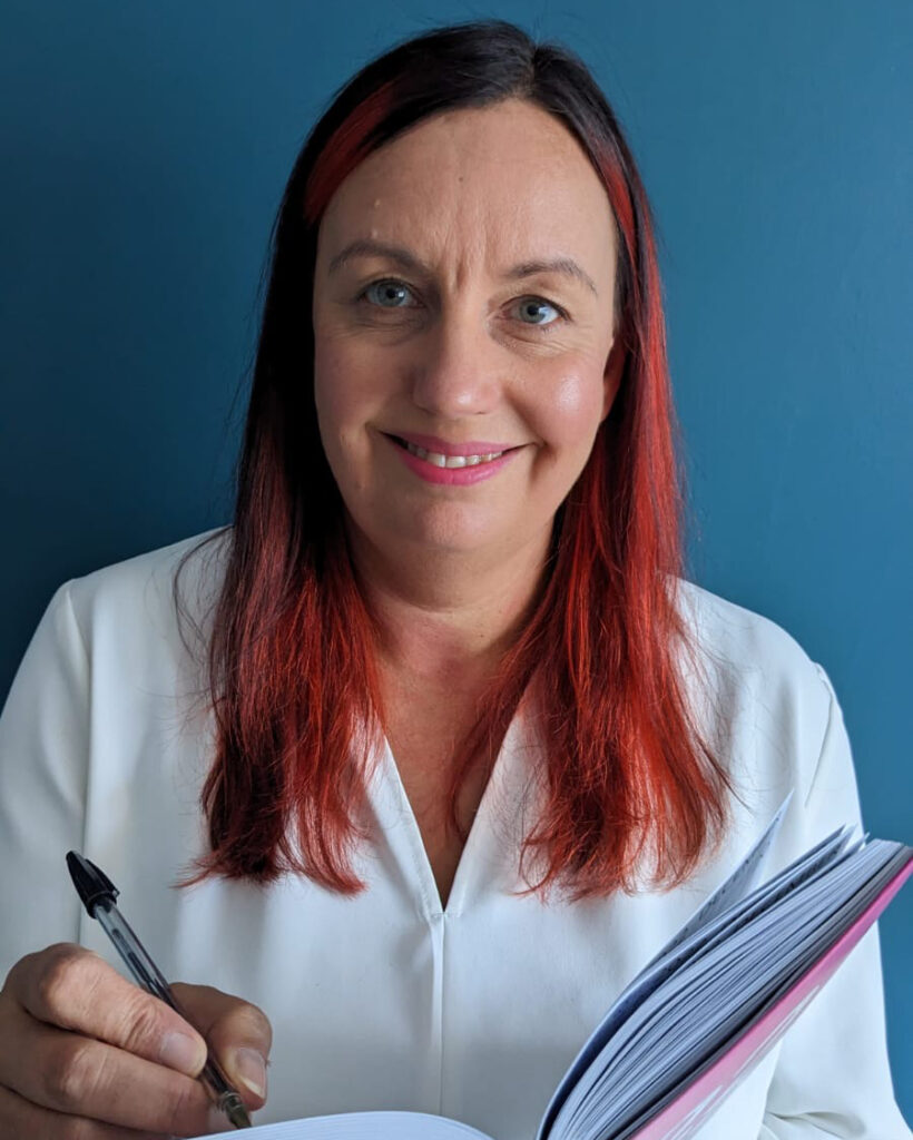An image of a smiling, confident business owner. Demonstrating the positive outcome of effective self-management strategies for boosted productivity. When you choose what not to do, running your company becomes enjoyable again. © Gil Devlin 2022
